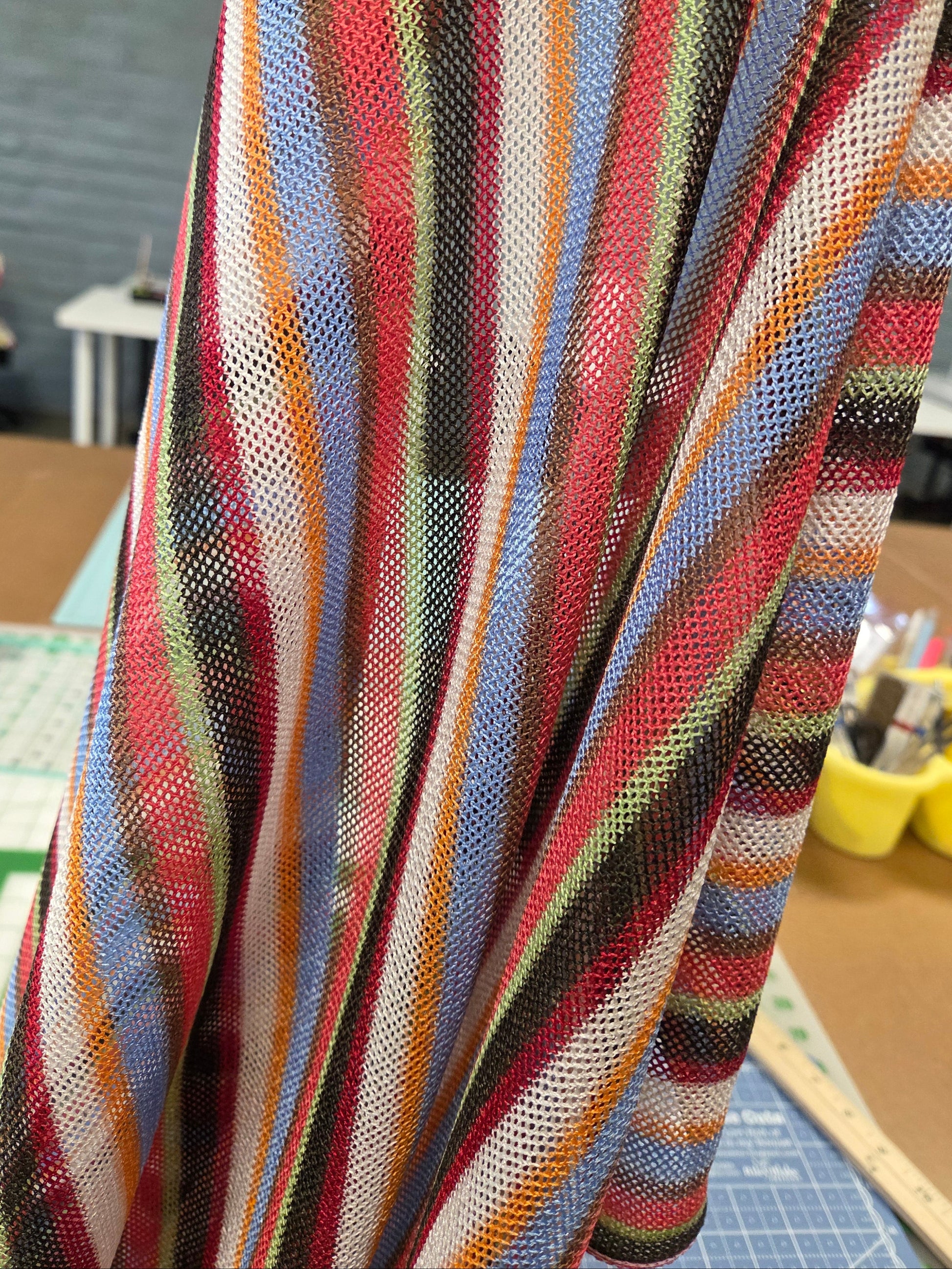 Multicolored striped fabric with a blurred background