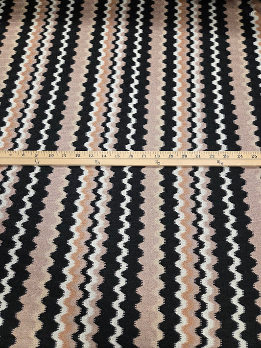 Textile with wavy black, white, and beige pattern