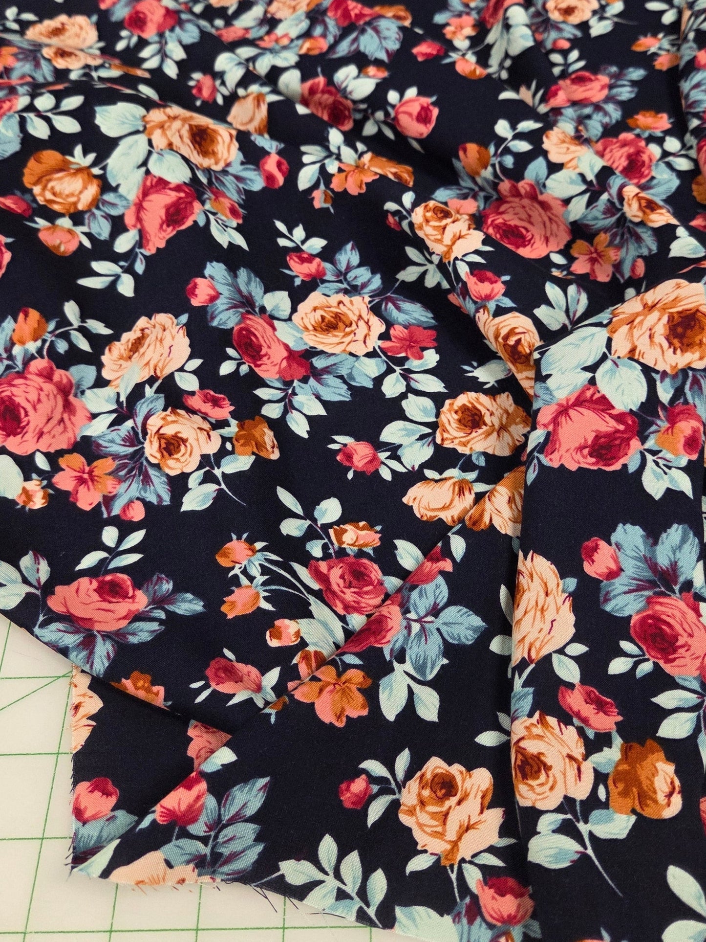 navy rayon chalis deadstock abrci with roses. fabric by the yard