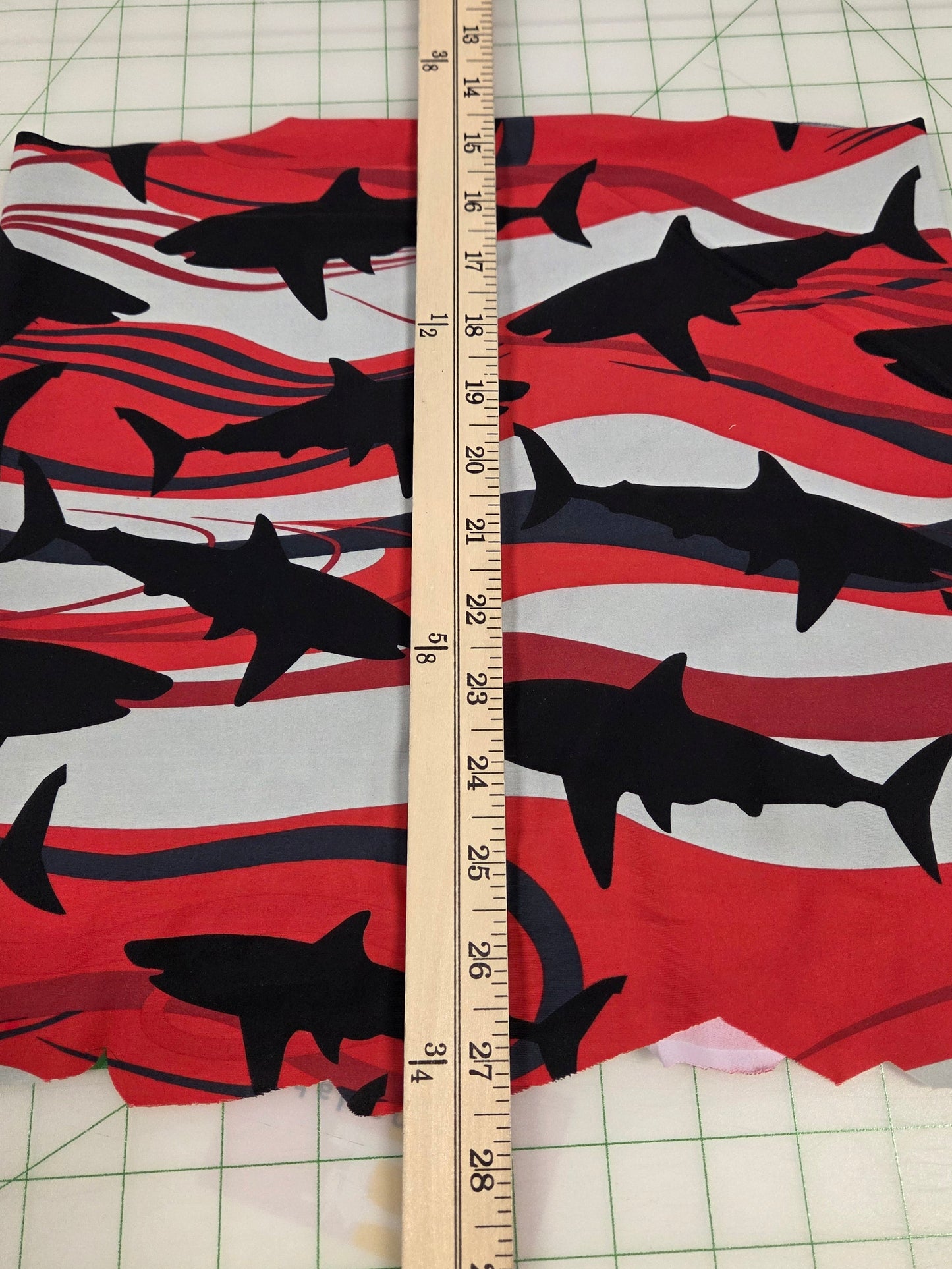 Fabric with shark pattern on a cutting mat with a ruler