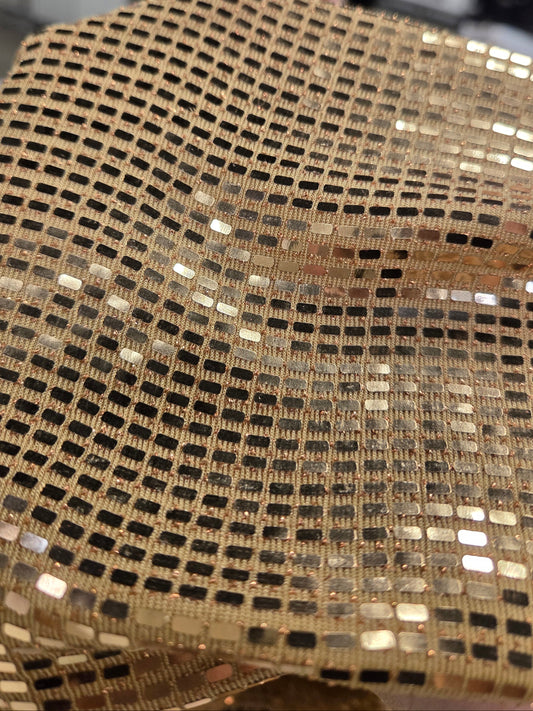 deadstock fabric jersey knit., ity gold knit with sequins, disco inspired.