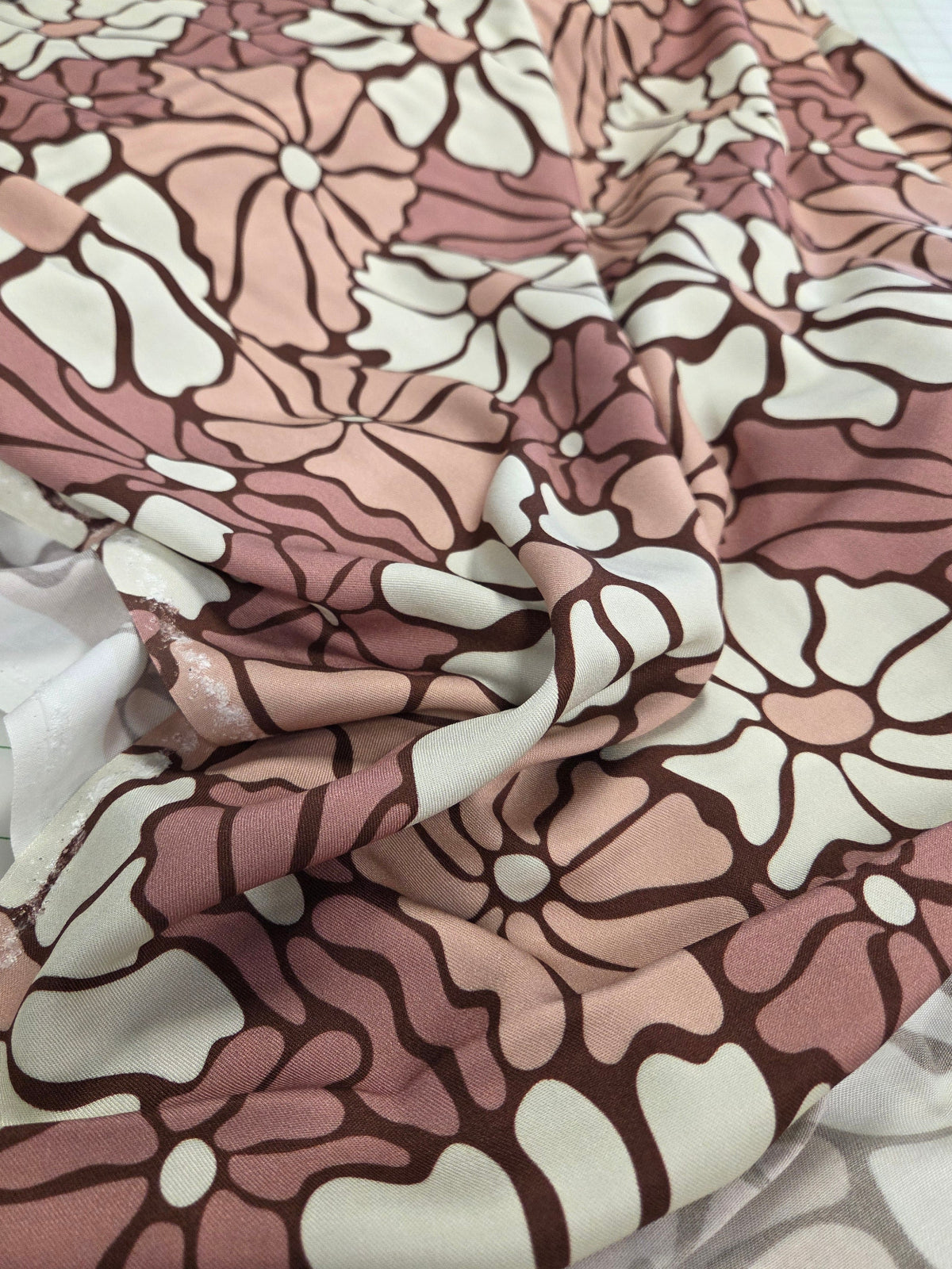 Floral patterned fabric on a cutting mat
