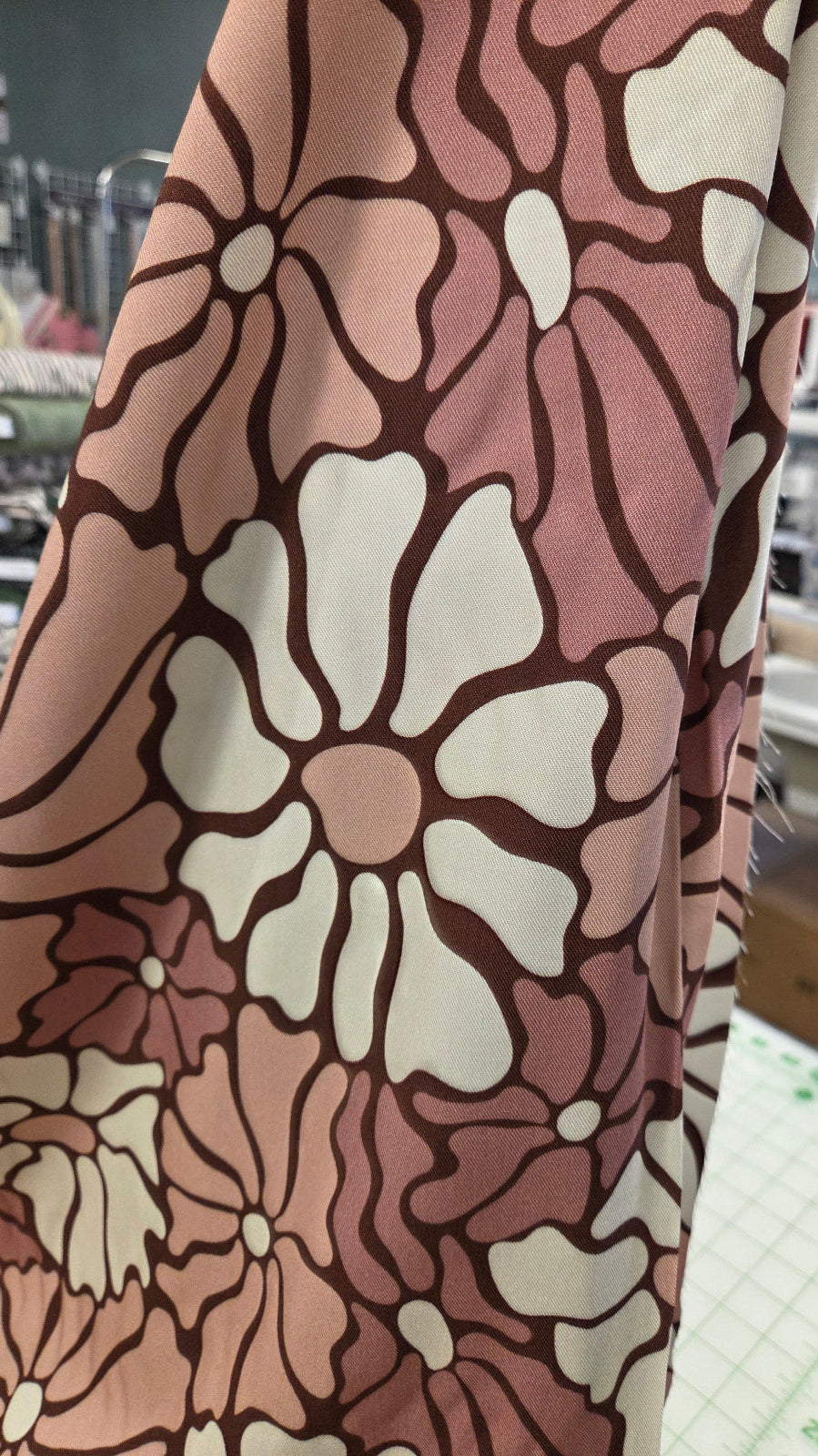 Floral patterned fabric with a blurred indoor background