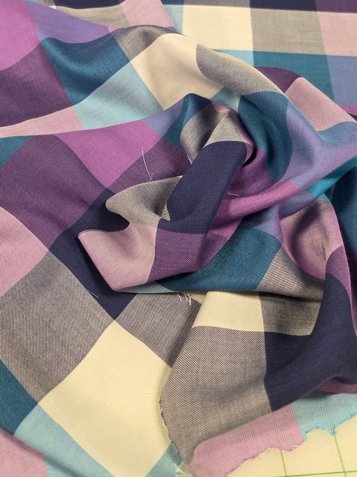 Multicolored checkered fabric on a tiled floor