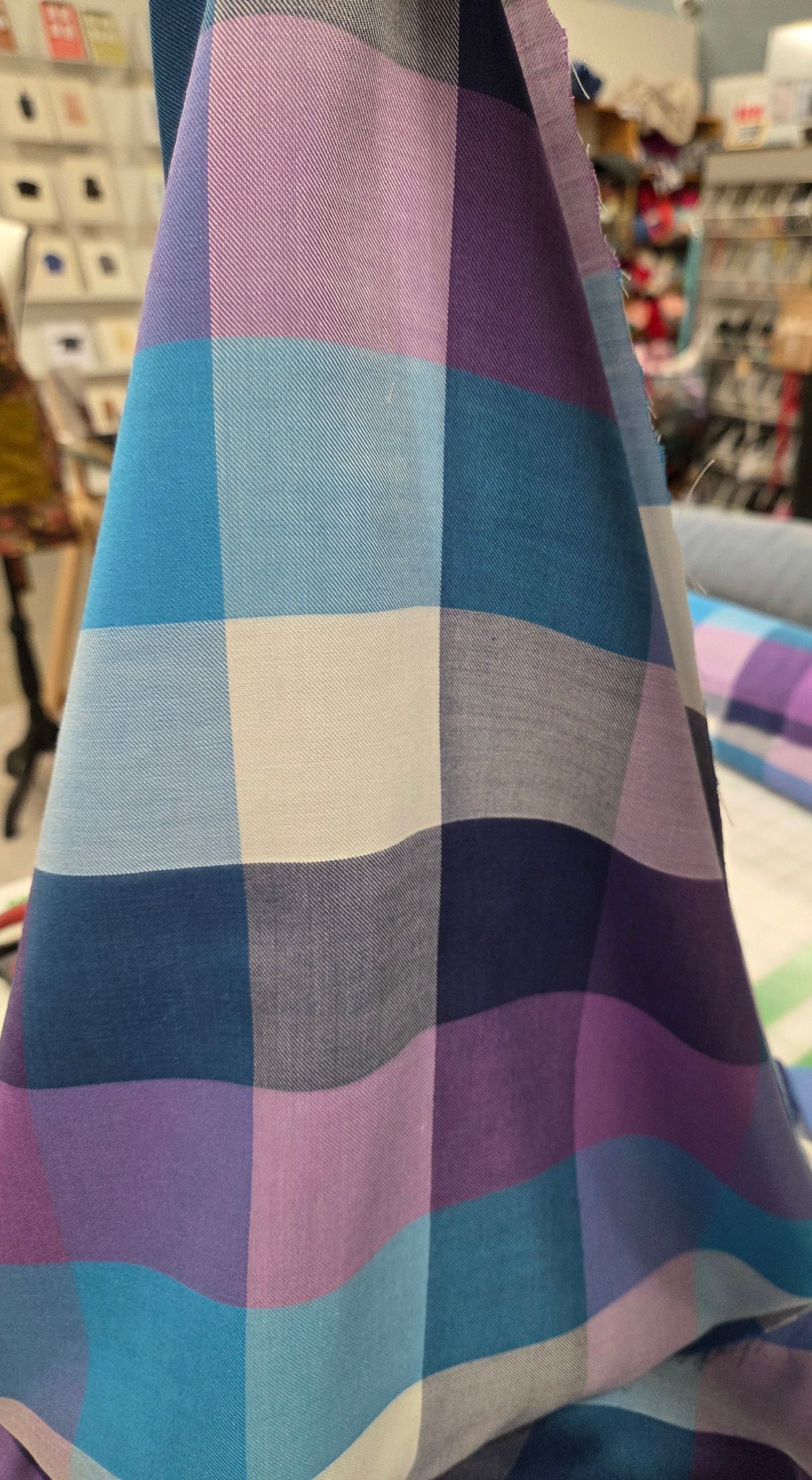Colorful checkered fabric in a store setting