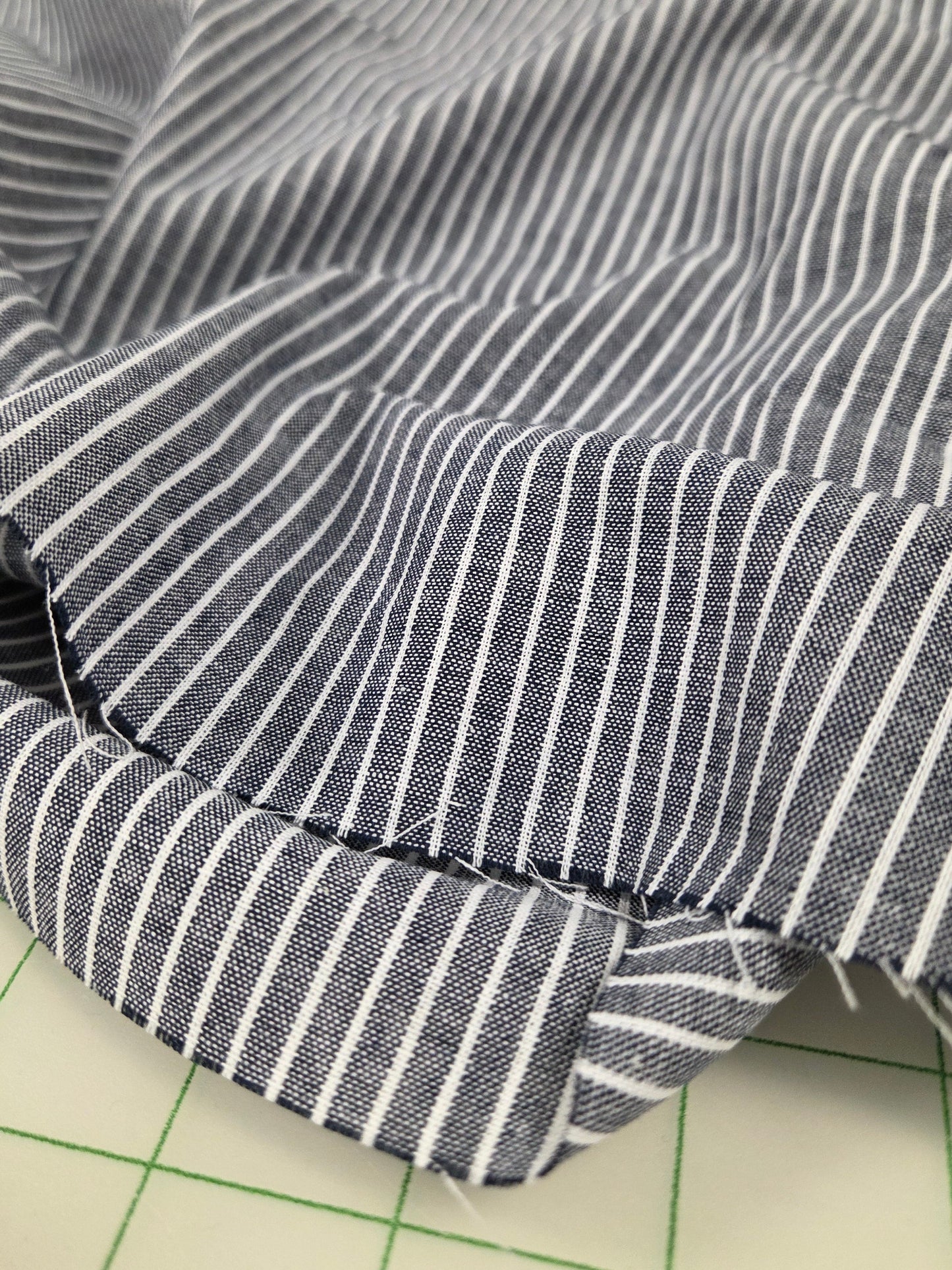 Close-up of striped fabric on a grid background