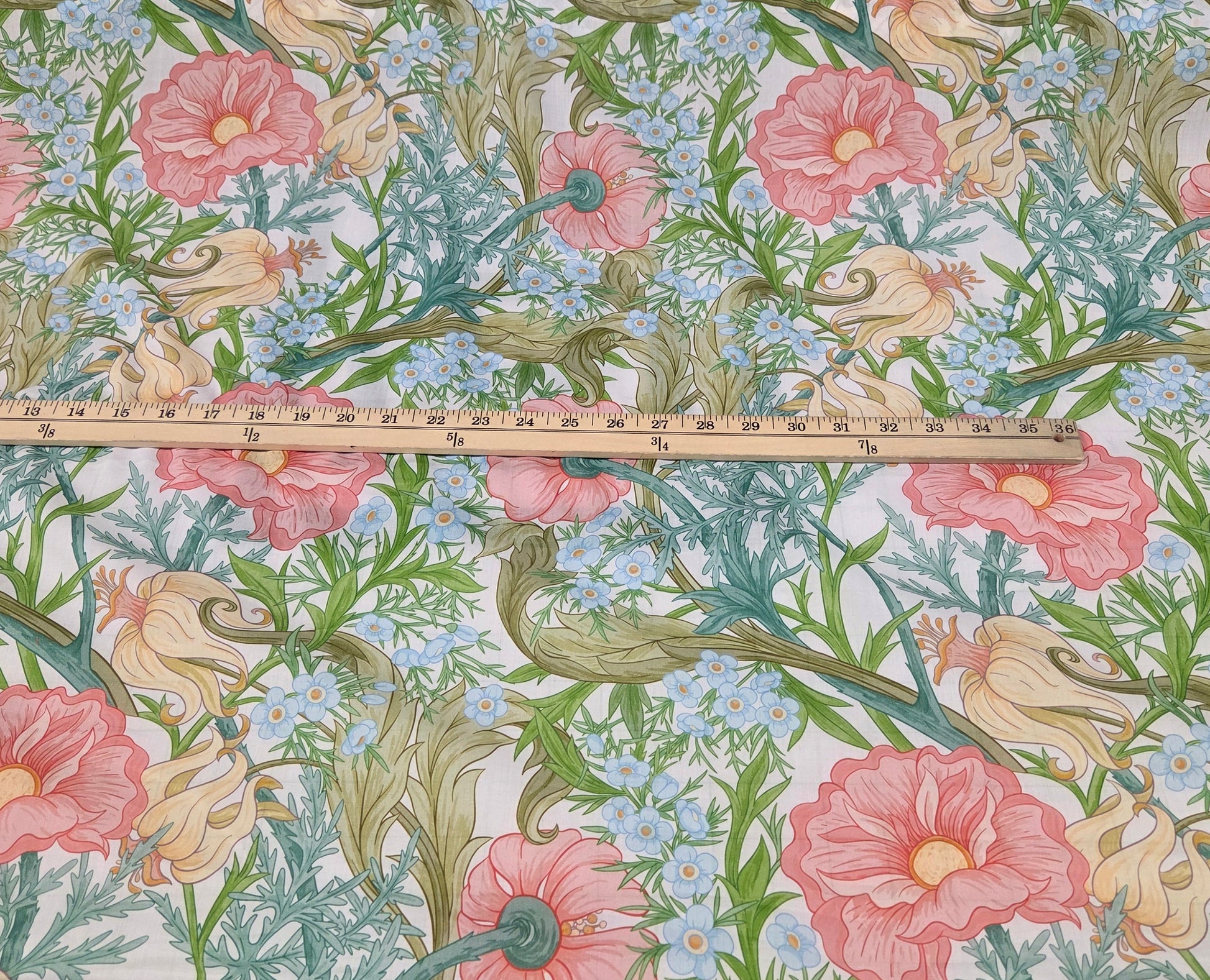 Floral patterned wallpaper with a grid and measurements on a plain background