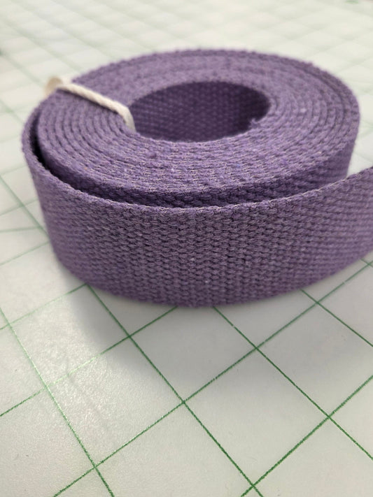 Purple belt on a white surface with grid lines