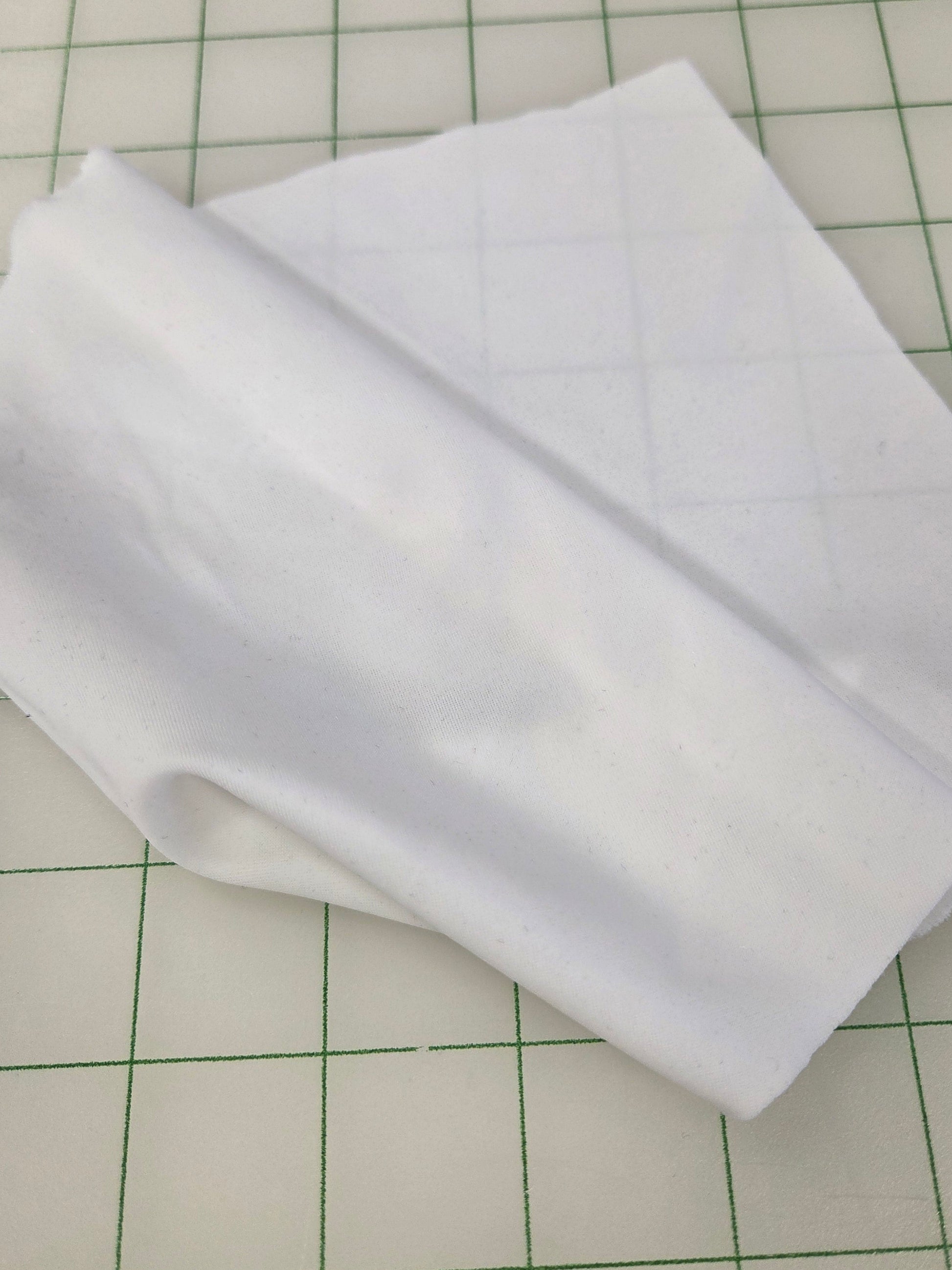 White fabric on a grid background