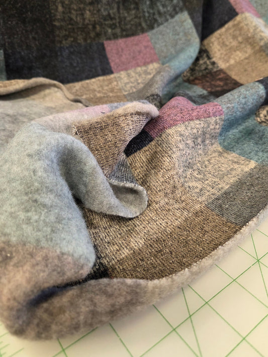 Close-up of patterned fabric on a cutting mat