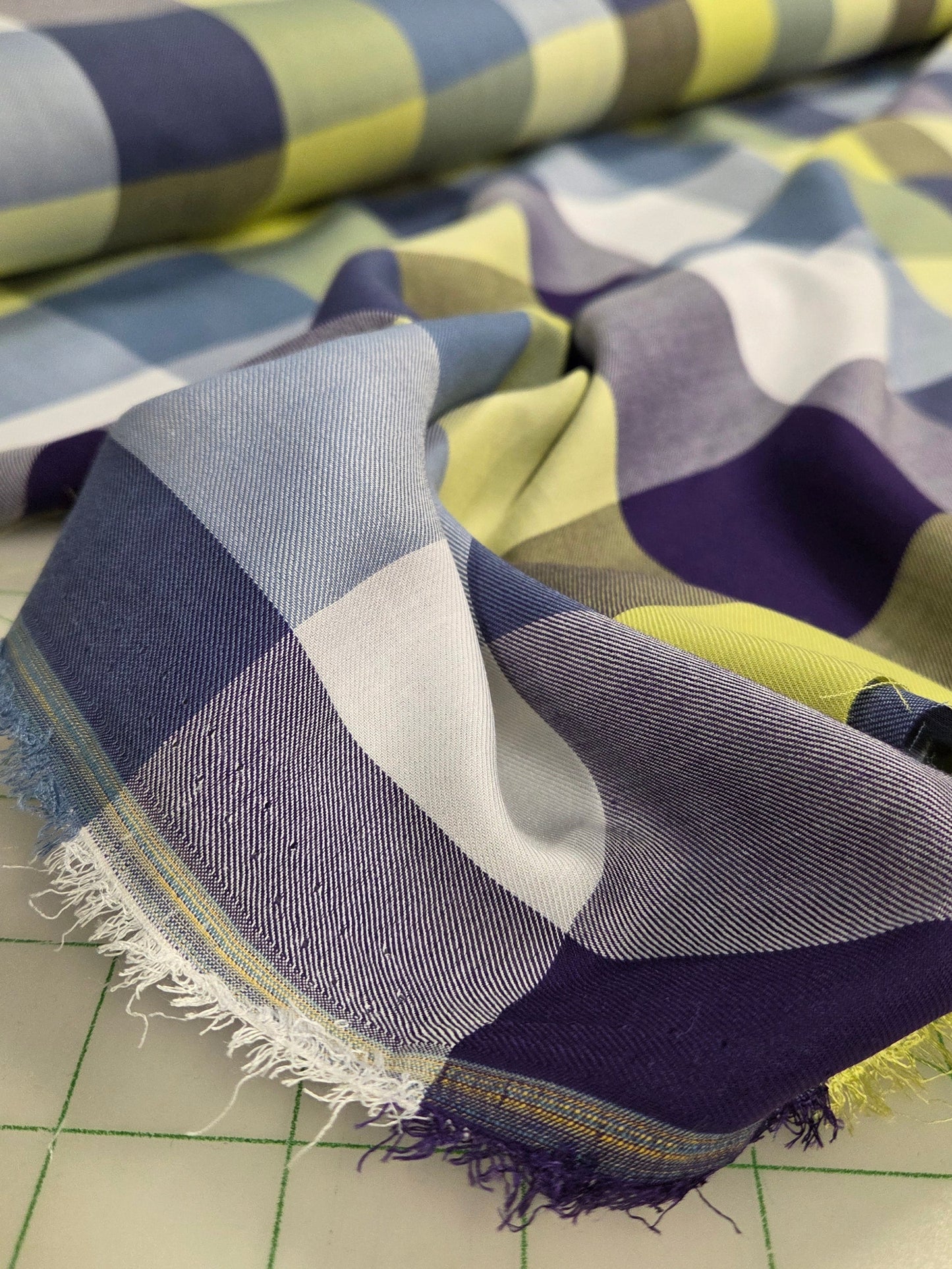Colorful fabric with geometric pattern on a cutting mat