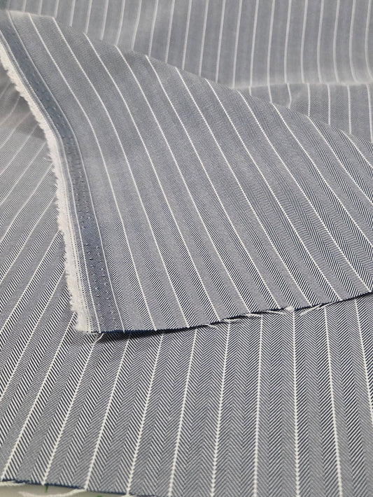 Gray striped fabric with measurements on a hanger