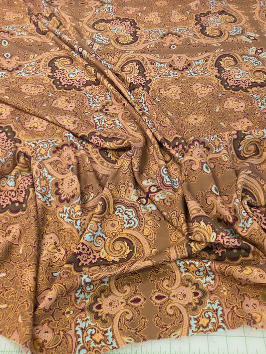 rayon crepe paisley woven in gold and magenta.