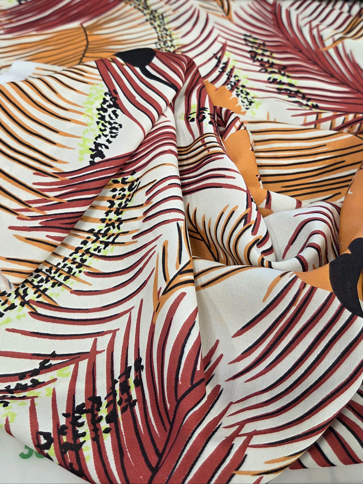 Close-up of patterned fabric with abstract design. Fashion Fabric by the yard