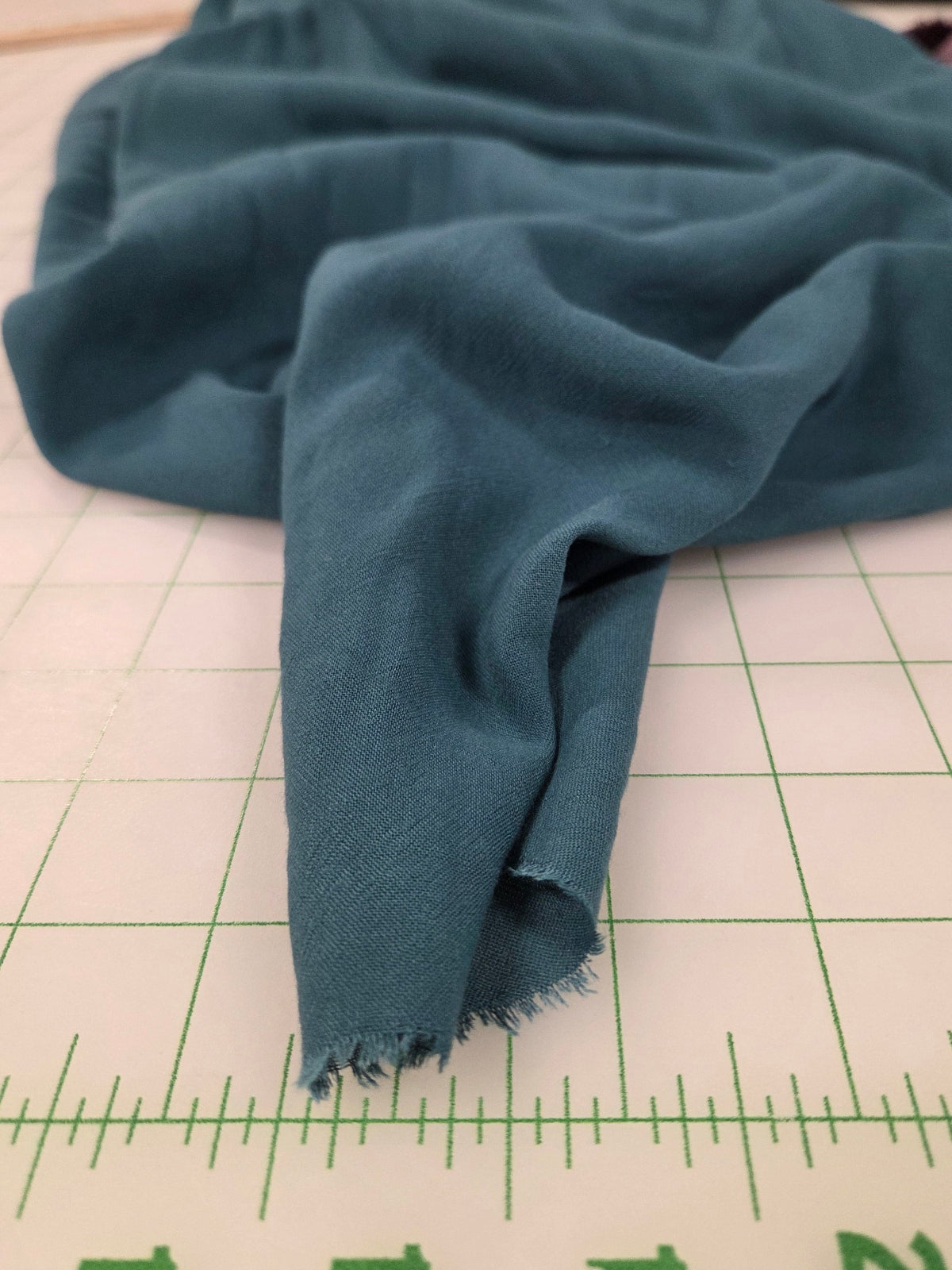 End of Bolt: 4-7/8th yards of Viscose Linen Textured 140GSM Matte Teal Shirting Woven- remnant