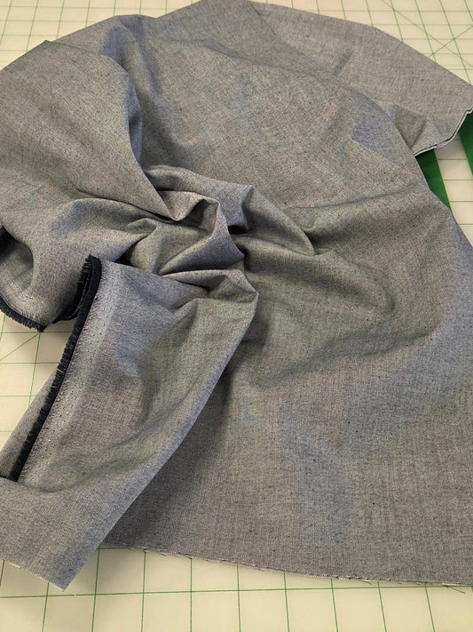 Gray fabric on a cutting mat with a ruler and Kangaroo branding.