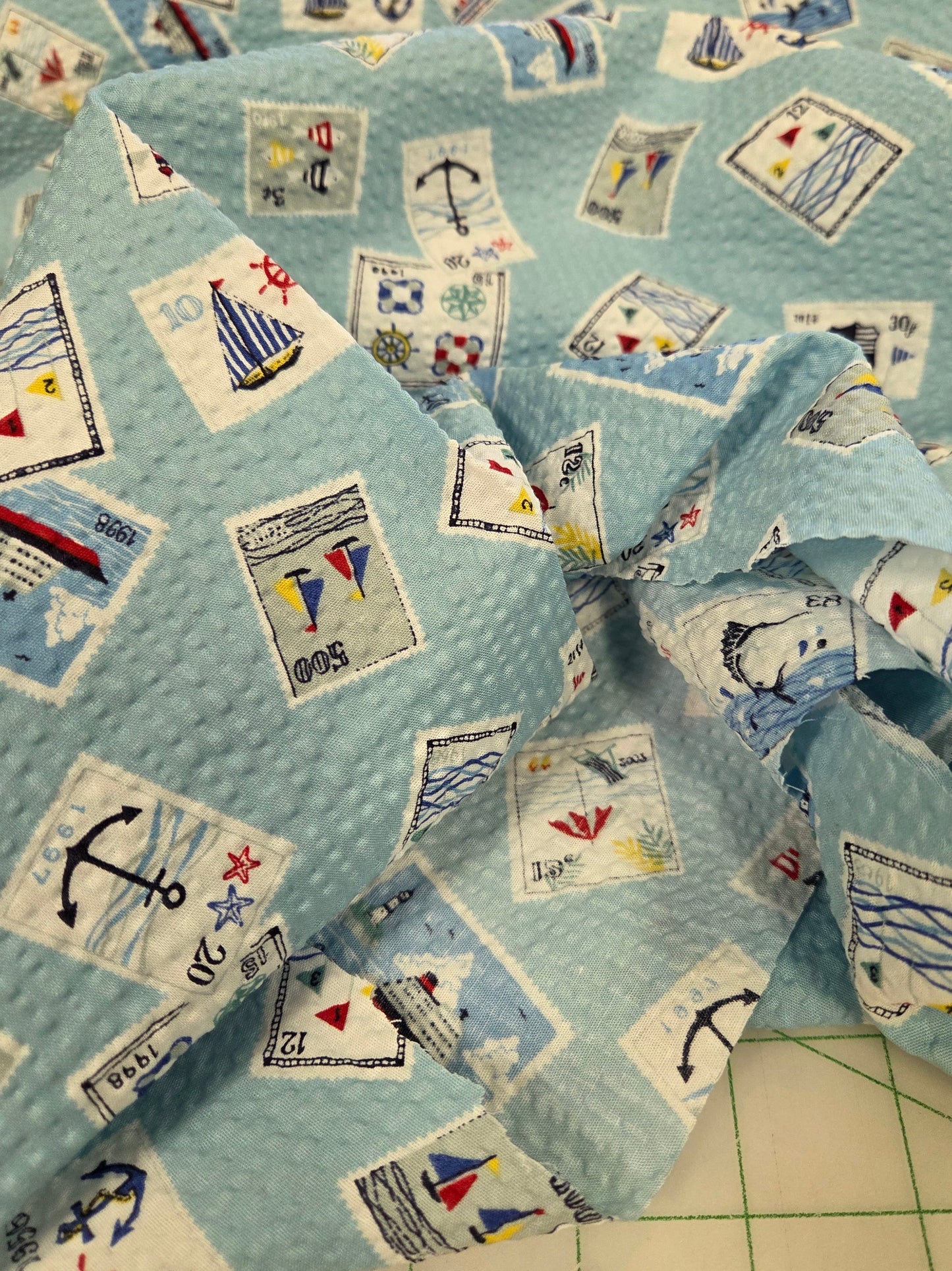 Japan Fabrics: Sevenberry Cotton Seersucker Nautical Stamps Print Light Blue Woven- by the yard