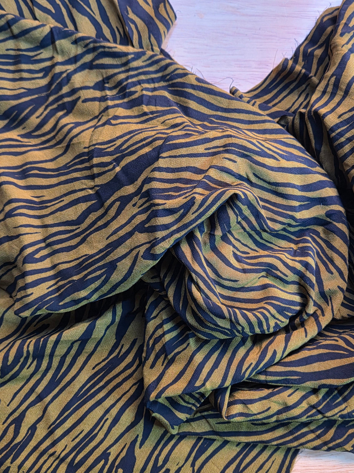 zebra pattern rayon crepe with green and black or clothmaking