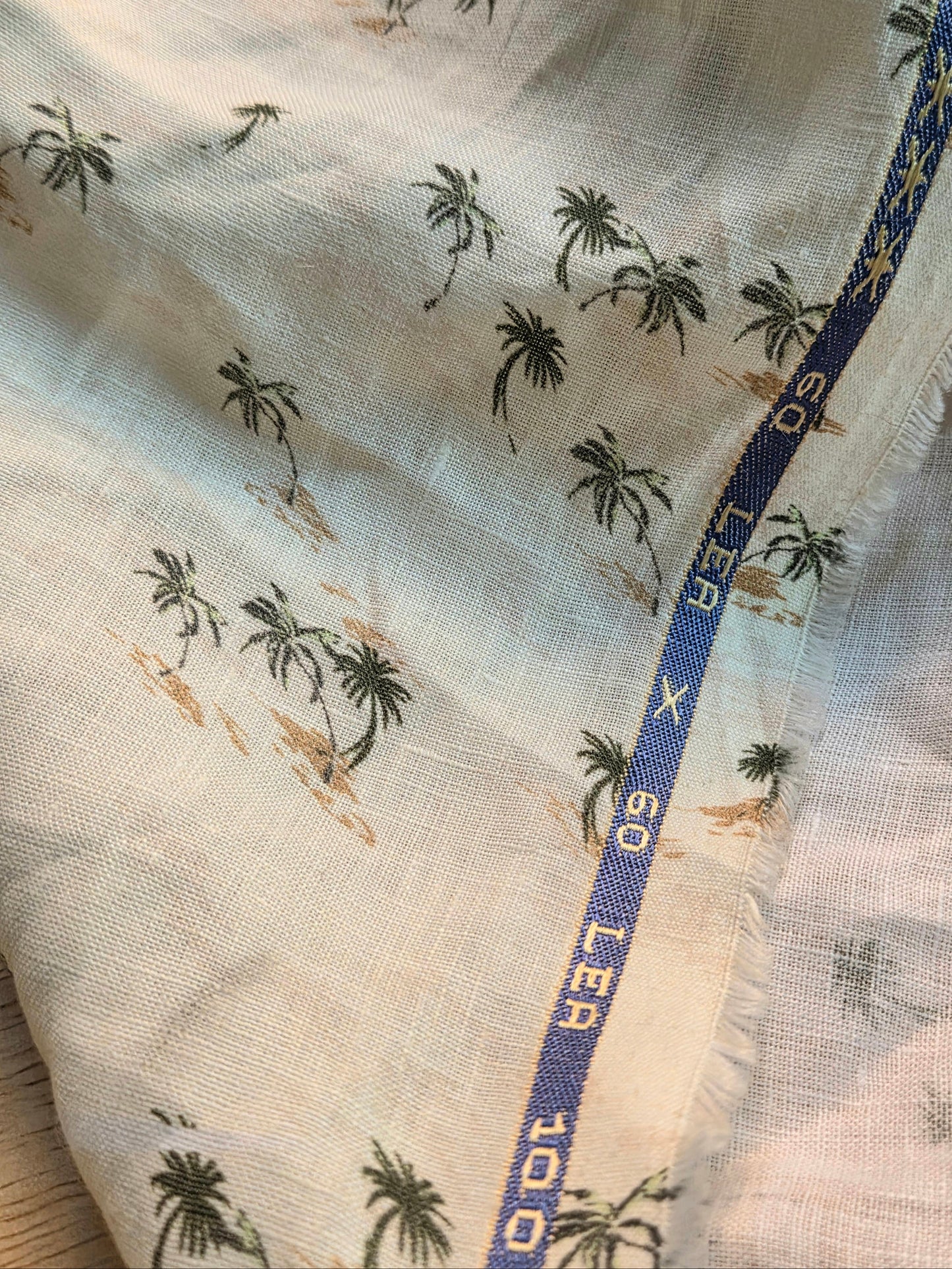 linen up close with palm trees and sand