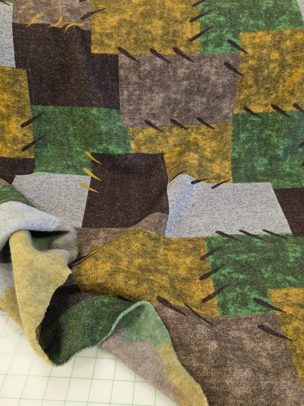 patchwork green and brown apparel hacci fleece knit