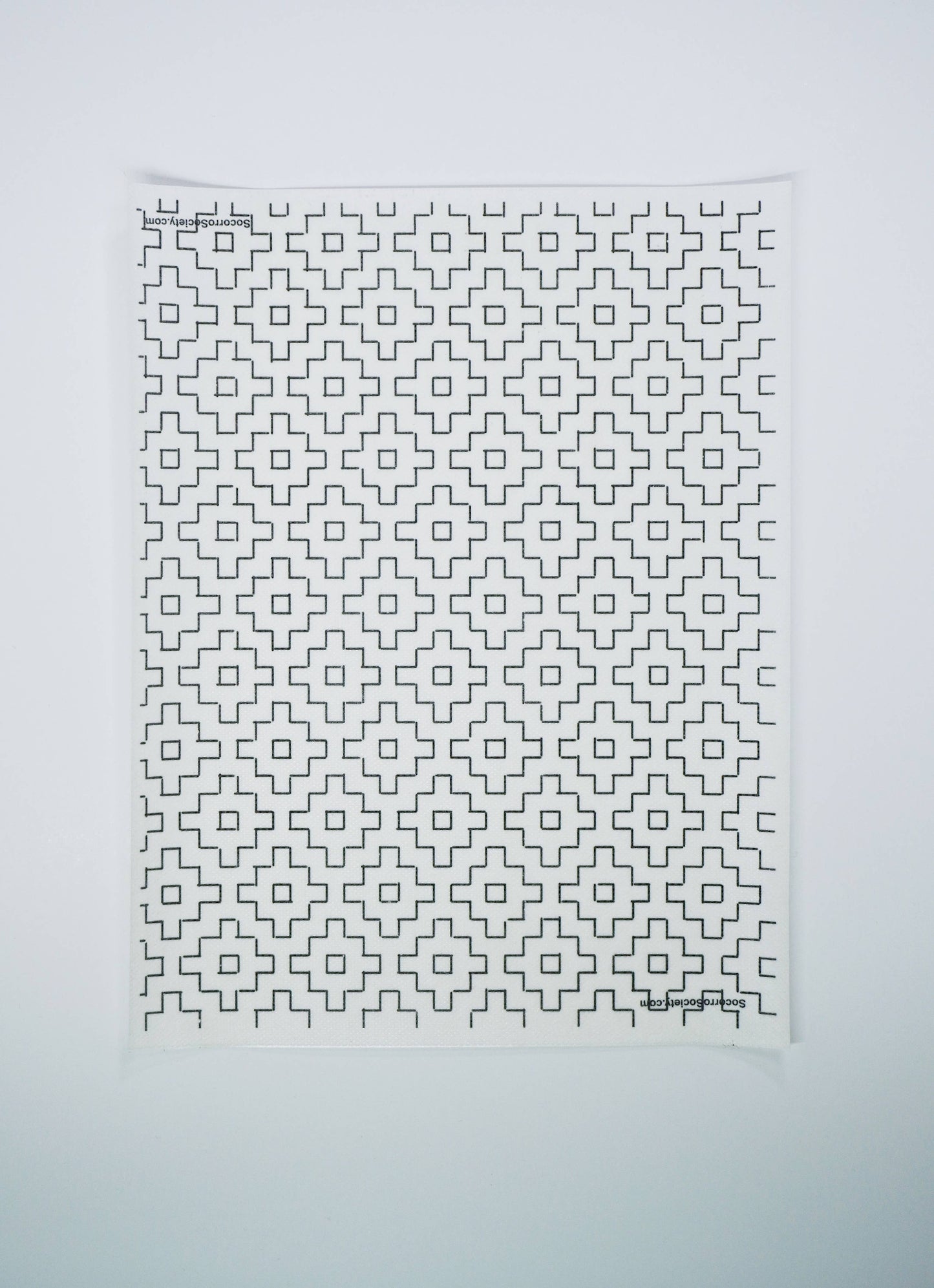Textile with geometric pattern on a white background