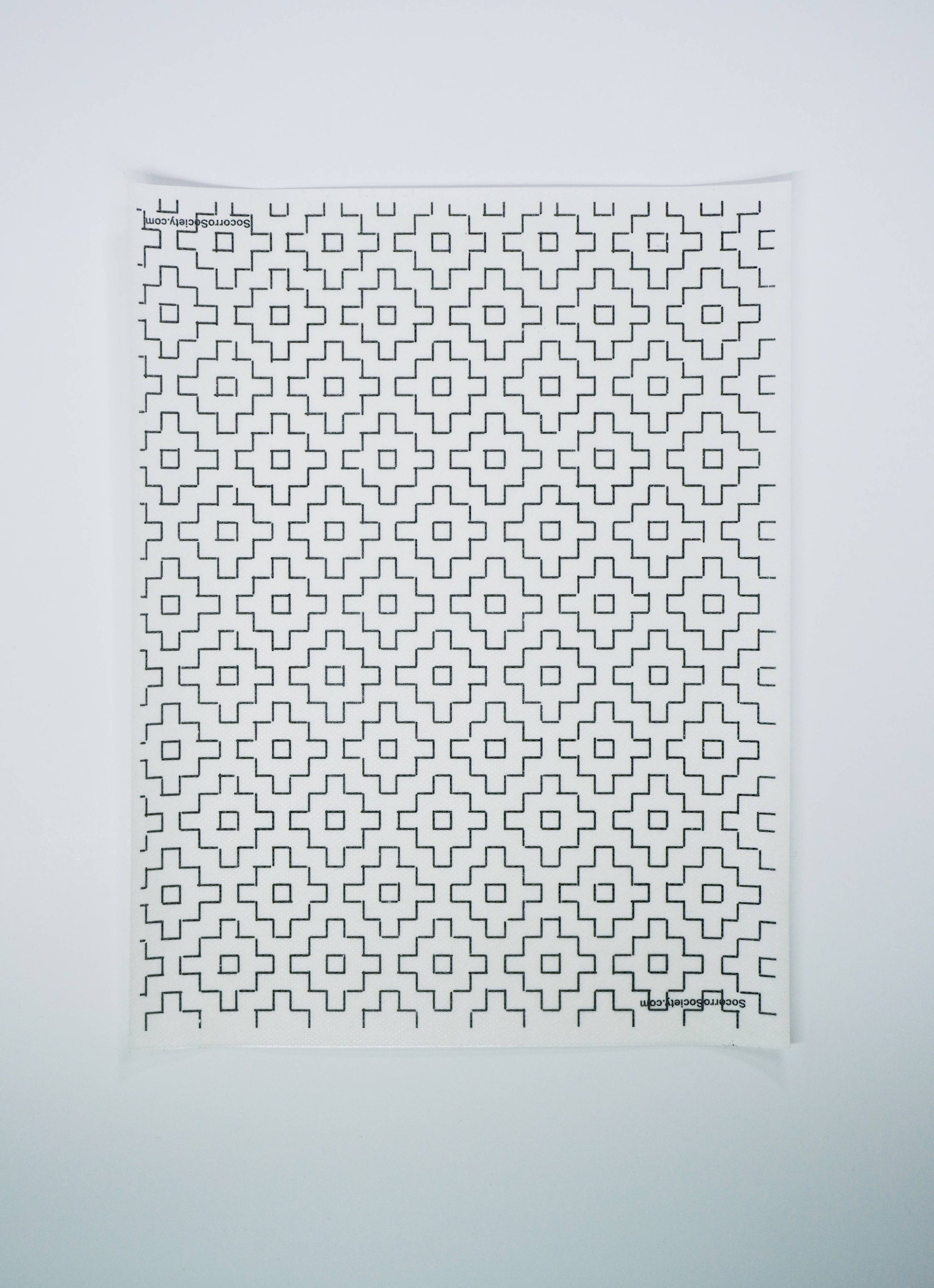 Textile with geometric pattern on a white background