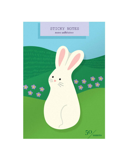 Sticky notes with a rabbit design on a green field with flowers