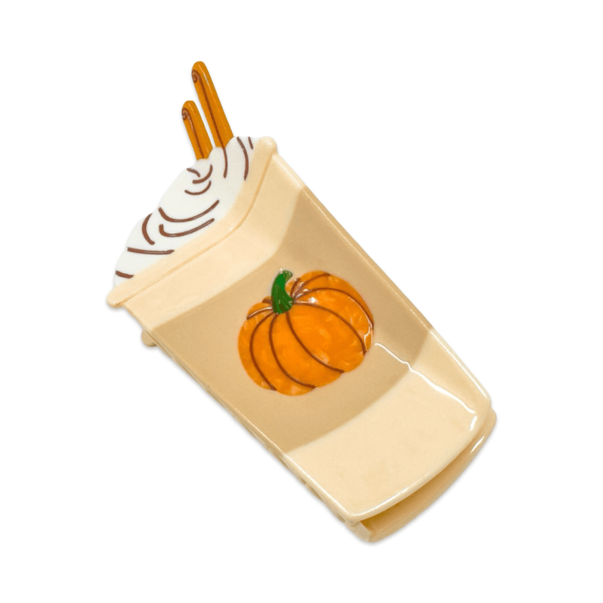 A ceramic coffee cup-shaped clip in warm cream, featuring a glossy orange pumpkin design on the front, brown whipped cream swirls on the lid, and two orange handles, shown on a plain white background. Jenny Lemons Hair Clip