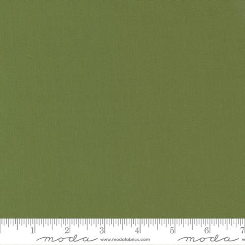 Solid green fabric swatch with a ruler at the bottom for scale. bella solid cactus green quilting cotton
