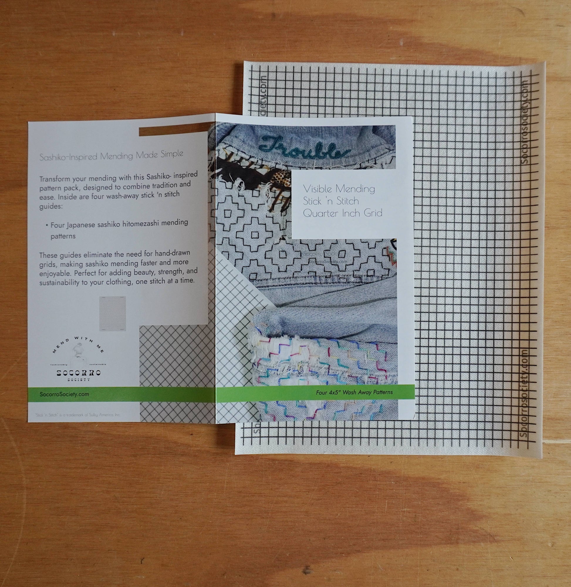 Pattern booklets and grid paper on a wooden surface