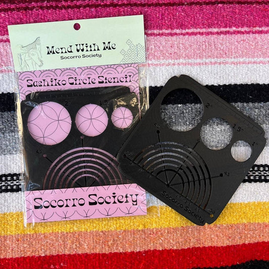 Sashiko circle stencil with packaging on a colorful striped background