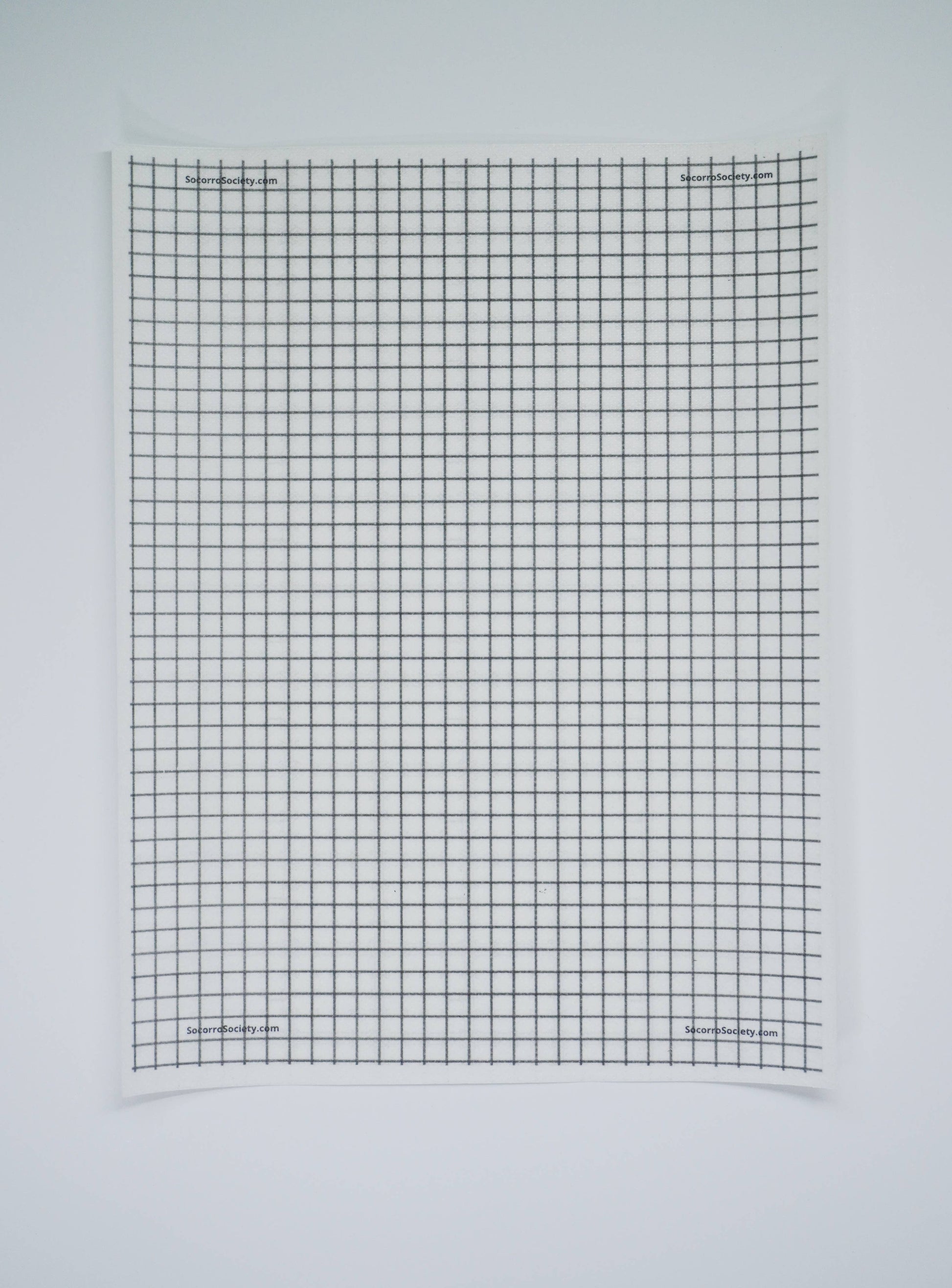 Black grid pattern on a light gray background