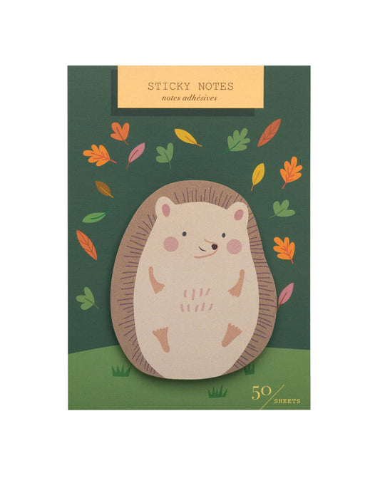 Sticky notes with a hedgehog design and autumn leaves on a green background
