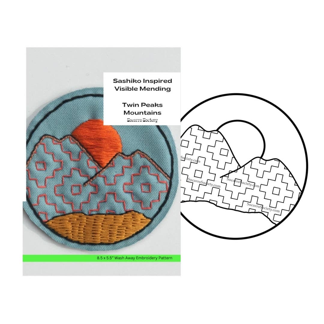Sashiko inspired visible mending patch with mountain design and embroidery pattern on a white background.