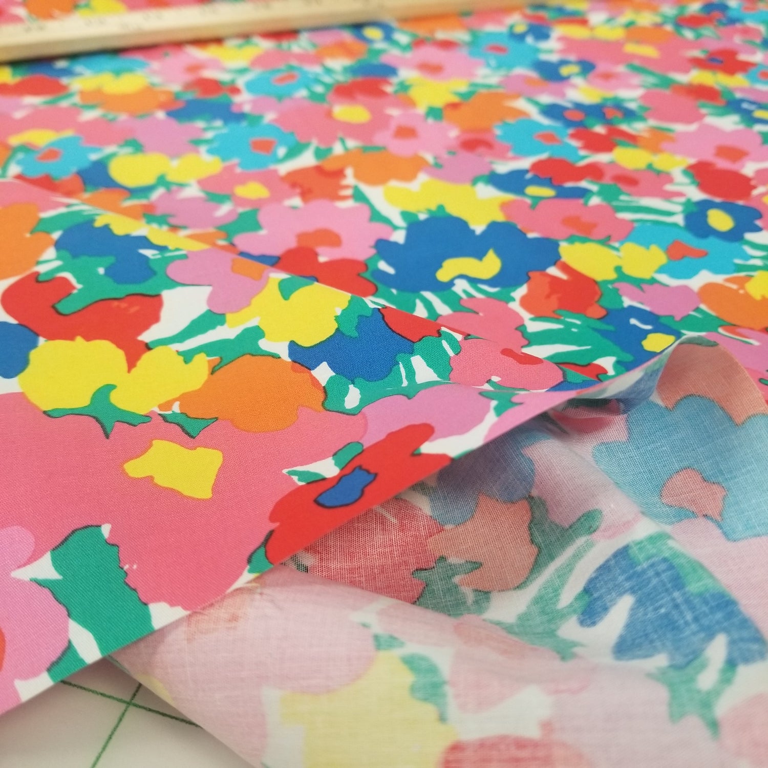 Colorful floral-patterned fabric with a close-up view