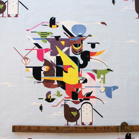 Abstract artwork of stylized birds with a ruler at the bottom for scale. organic Charely harper fabric